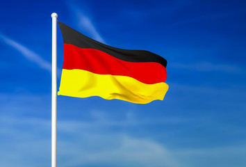 Waving flag of Germany on the blue sky background