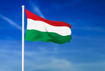 Waving flag of Hungary on the blue sky background