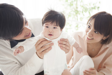 Dad and mommy and cute baby.