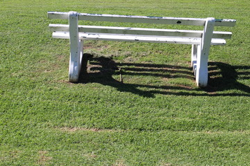 park bench with shadow