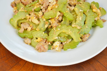 stir fried bitter cucumber with minced pork and egg on plate