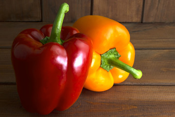 Juicy beautiful Bulgarian pepper on a wooden background