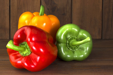 Juicy beautiful Bulgarian pepper on a wooden background
