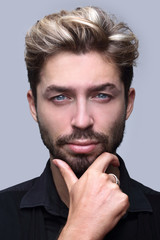 thoughtful businessman holding his hand under his chin