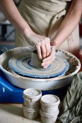 Beginner potter at work on the circle