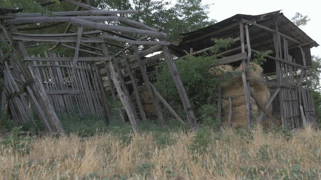Countryside. Wooden old barn for storage of hay in the village
