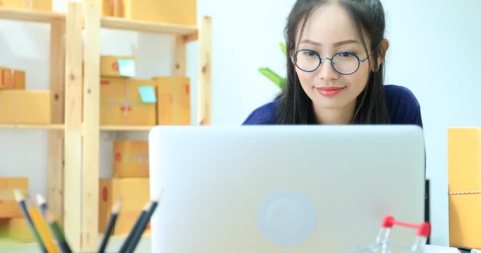 Asian Woman Working at home, Young business start up with Online Business or SME Concept.
