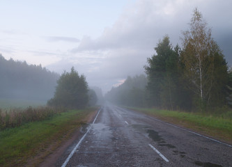 Fototapeta na wymiar Rural country road with fog