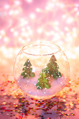 miniature with three paper pinetrees in the aquarium.