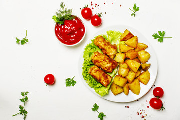 Fish and chips with tomato sauce ketchup, white background, top view