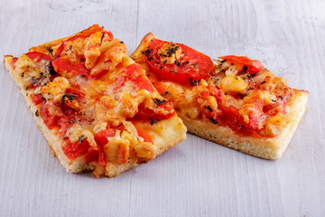Fresh pizza on a wooden background