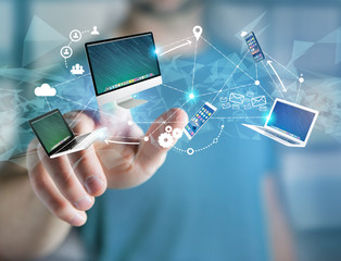 Computer and devices displayed on a futuristic interface with interantional network - Multimedia and technology concept
