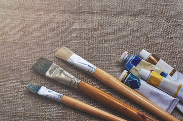 different paint brushes and oil paints