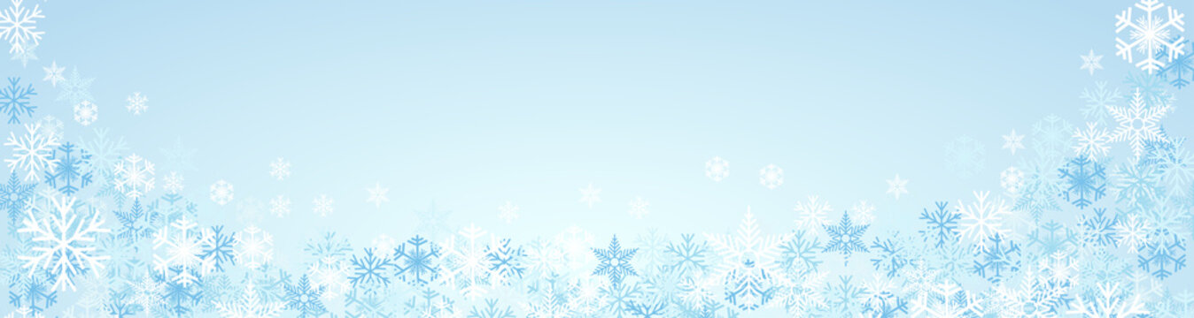 Festive banner Christmas background and winter with copy space. snow and ice crystals on blue sky