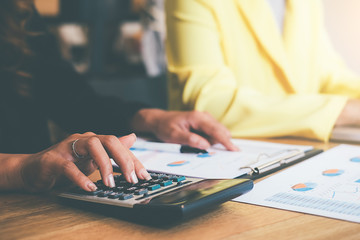 Business concept. Business people discussing the charts and graphs showing the results of their successful teamwork.