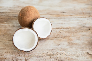 Bowl and scoop with white sand and lump sugar on wooden background