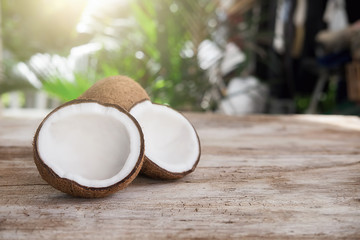 Bowl and scoop with white sand and lump sugar on wooden background