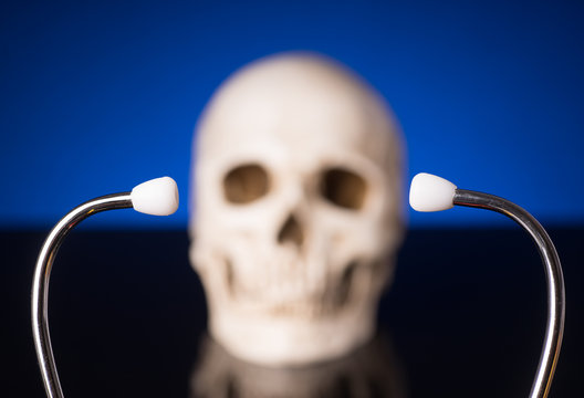 Stethoscope and blurry skull