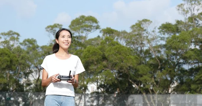 Woman control fly drone