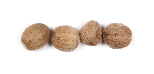 Nutmeg isolated on white background, top view