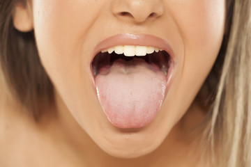 woman shows her tongue
