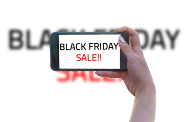 Hand hold mobile phone and take  photo wording black friday sale on isolate white background