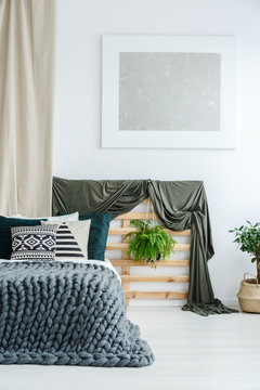 Coverlet on wooden bedhead