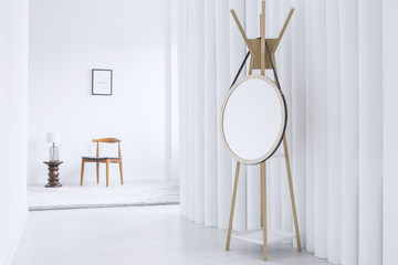 Mirror in white corridor