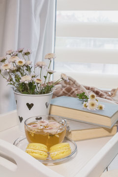 Perfect place for rest with flowers, tea and books