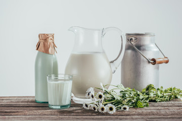 jugs, bottle and glass of milk