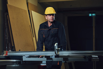 Carpenter male in a work place.