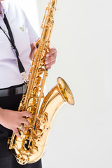 Students are playing saxophone in college, Thailand.