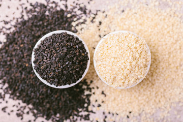 Black and white sesame seeds. Copy space. Top view.
