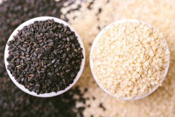 Black and white sesame seeds. Copy space. Top view.