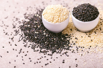 Black and white sesame seeds. Copy space. Horizontal view.