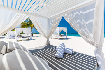 Luxury beach scene and loungers and sea view