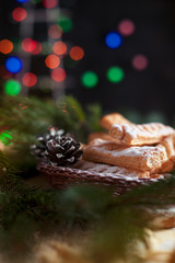 homemade cookies on the festive New Year's table. Christmas tree and garland