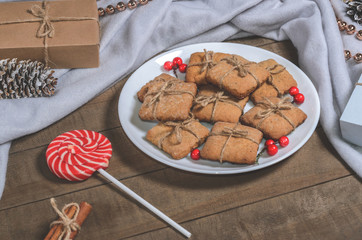 Candy and homemade cookies in Christmas decor top view