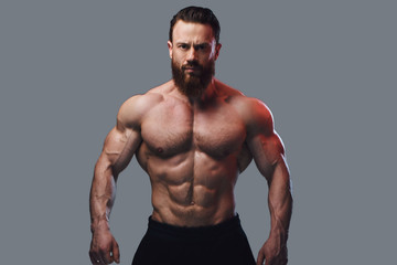 Portrait of bearded shirtless bodybuilder.
