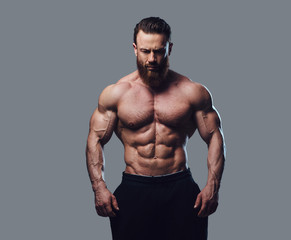 Fototapeta premium Portrait of bearded shirtless bodybuilder.