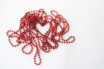 Valentine's day with heart bead on white background and place for signature