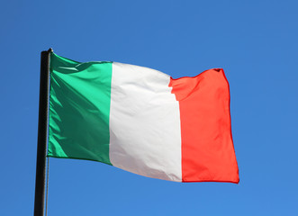 Naklejka na ściany i meble Italian flag waving in blue sky with vivid red and white green c