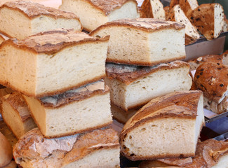 loaves of homemade bread for sale in the neighborhood bakery