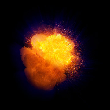 Realistic fire explosion, orange color with blue cast and sparks isolated on black background