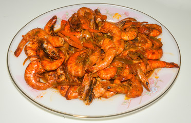 delicious homemade hot shrimp with tomato, pepper, carrot and onion