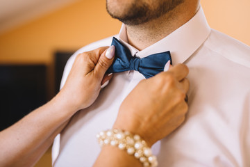 mother binds blue bow tie