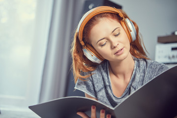the image of resting sexy woman listening to vinyl
