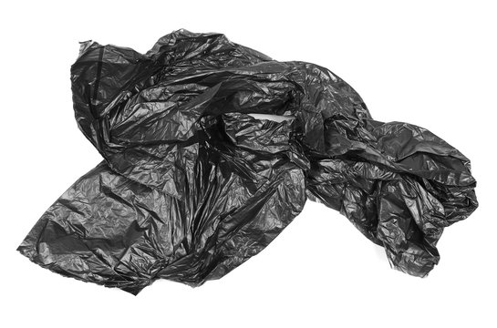 Crumpled black plastic garbage bag, isolated on white background, top view