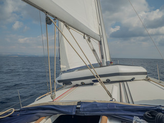 Obraz premium Byboat fixed on sailing boat sailing with open sails.