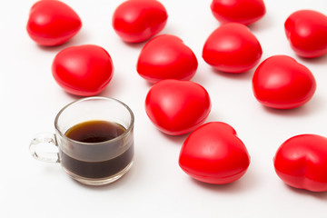 Cup of coffee with hearts on white table. Top view with copy space. Valentine's day background